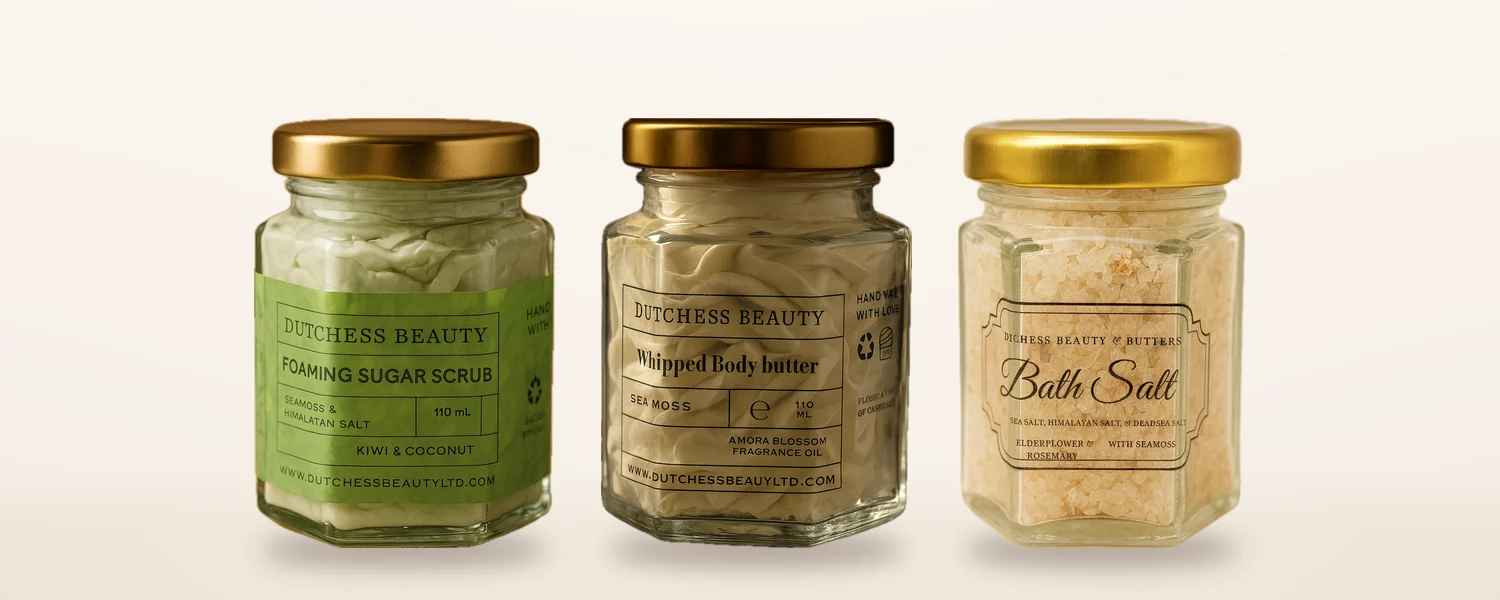 Three jars from the Seamoss Self-Care Gift Box: a foaming sugar scrub, a whipped body butter and a bath salt